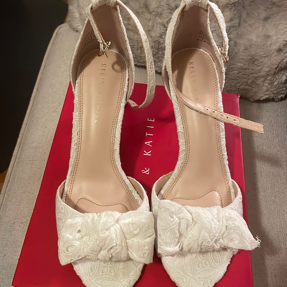 Brand new never worn white shoes with cute bow.